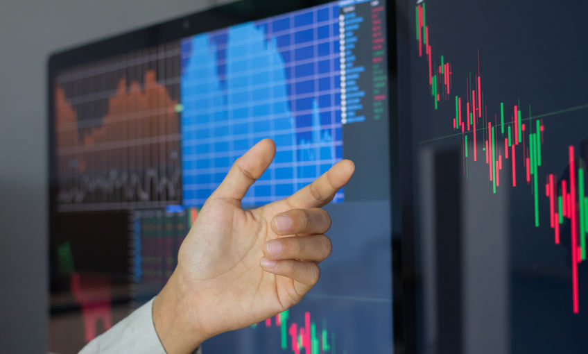 Hand of businessman pointing and look directions change Average line Share price movement Stock trading in the up and down. On the display screen Computer.